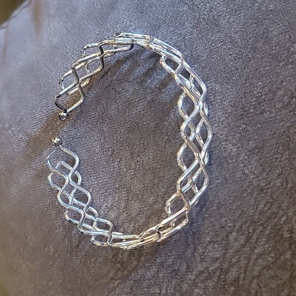 3/$30 Silvertone Braided Wave Cuff Bracelet - Picture 2 of 5
